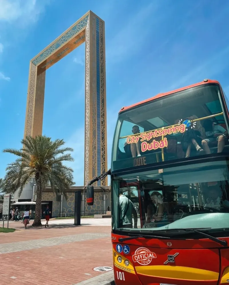 City Sightseeing open-top bus beside the Dubai Frame