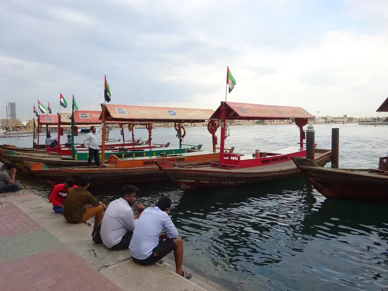 Wooden abras moored at an abra station on Dubai Creek
