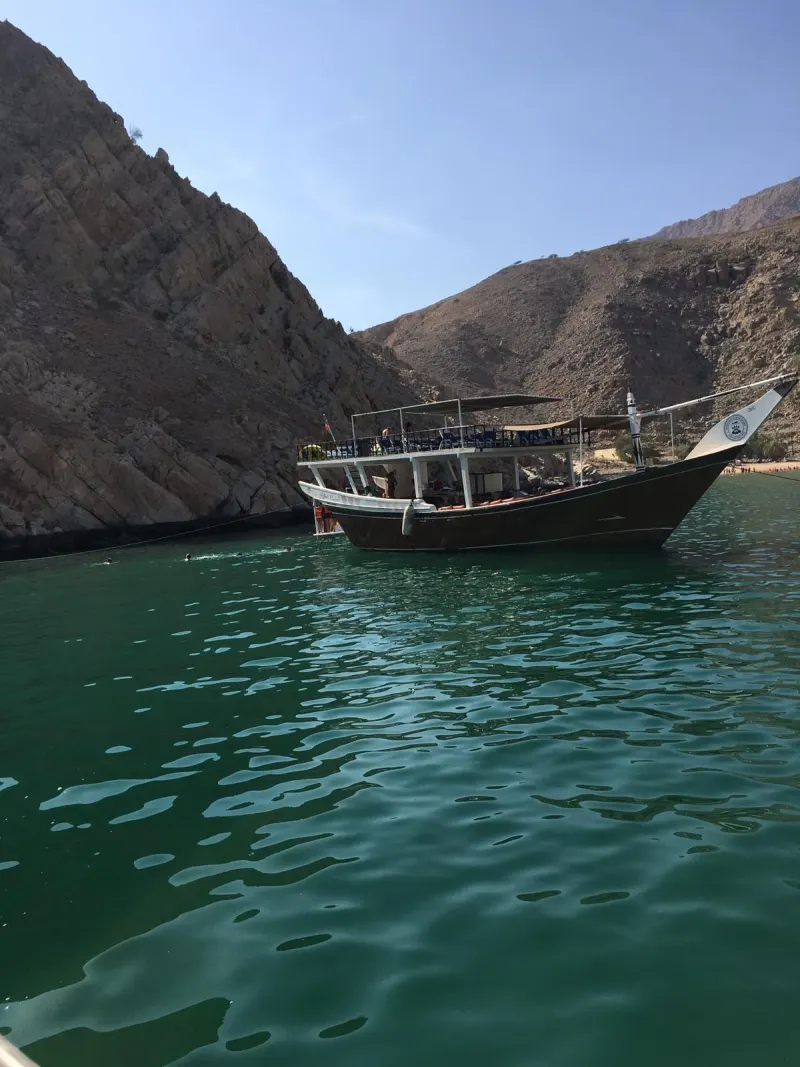 Tourist dhow in a bay of the Musandam coast near Dibba