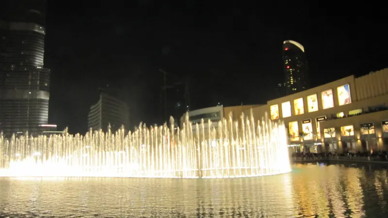 The Dubai Fountain show at night beside The Dubai Mall