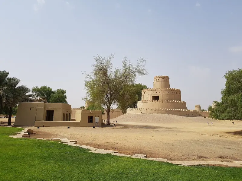 Al Jahili Fort and its round tower in a garden, Al Ain