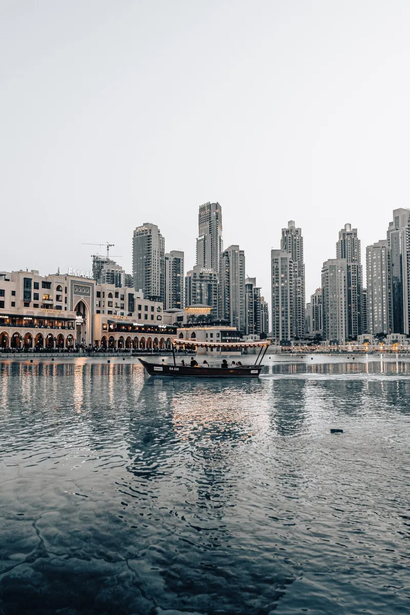 Abra boat on Burj Lake with the Downtown Dubai towers behind