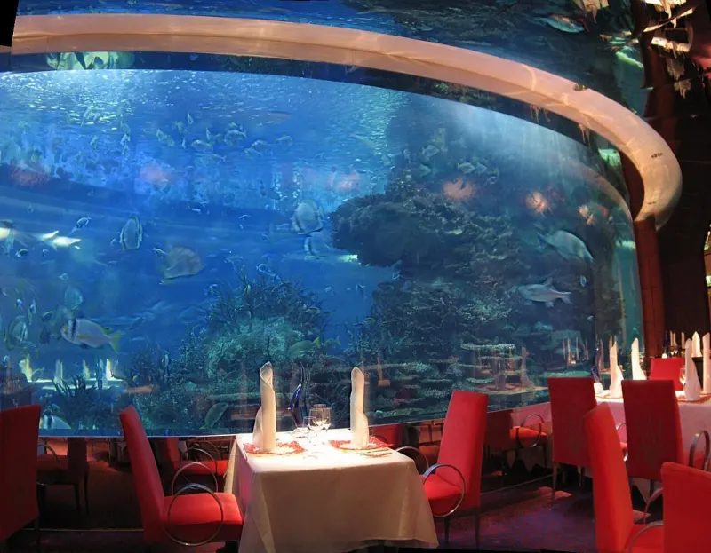 Tables beside the large aquarium of Al Mahara, Burj Al Arab