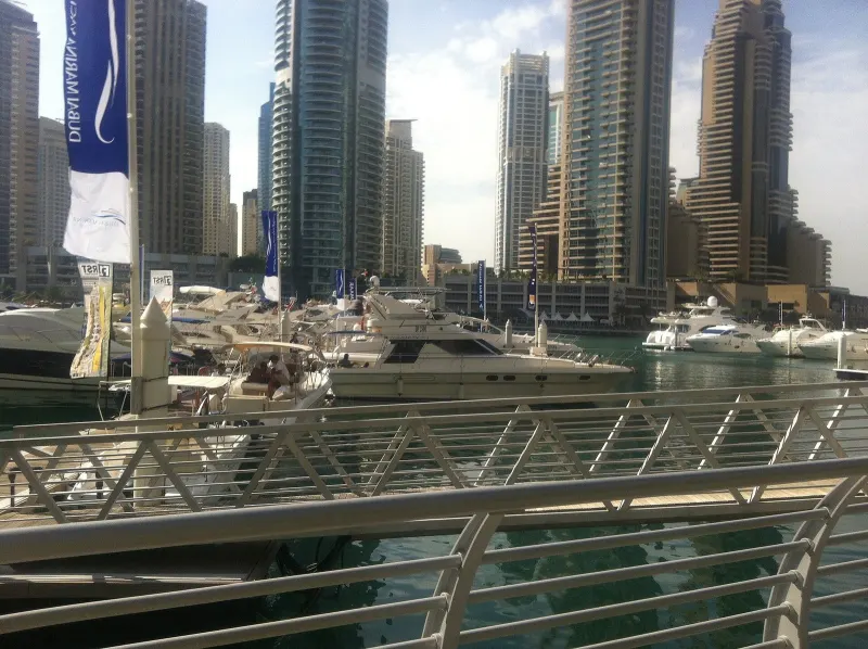 Motor yachts moored along the Dubai Marina Walk