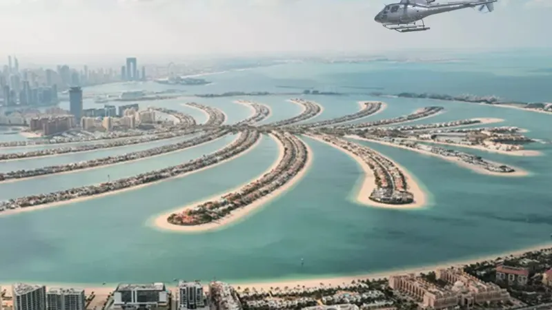 Helicopter above the fronds of the Palm Jumeirah
