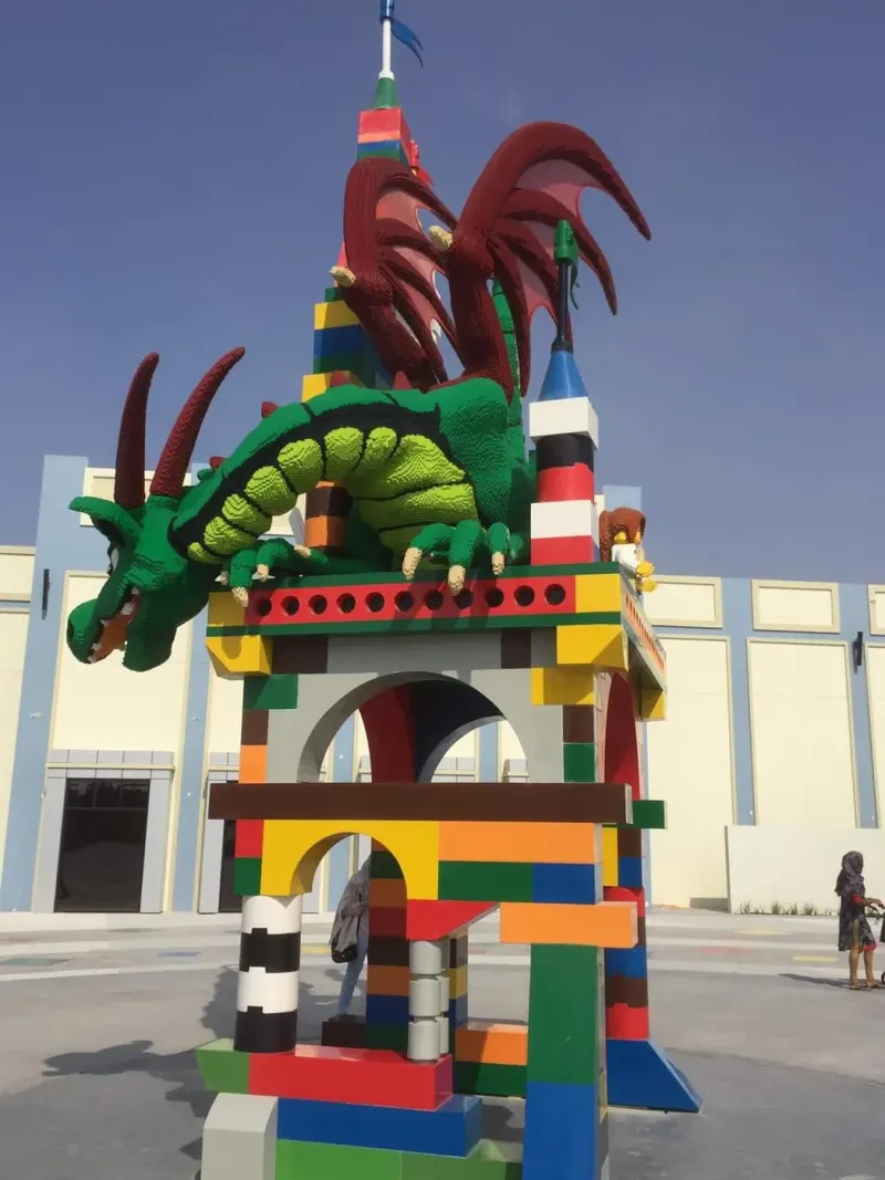LEGO dragon model on a colourful tower