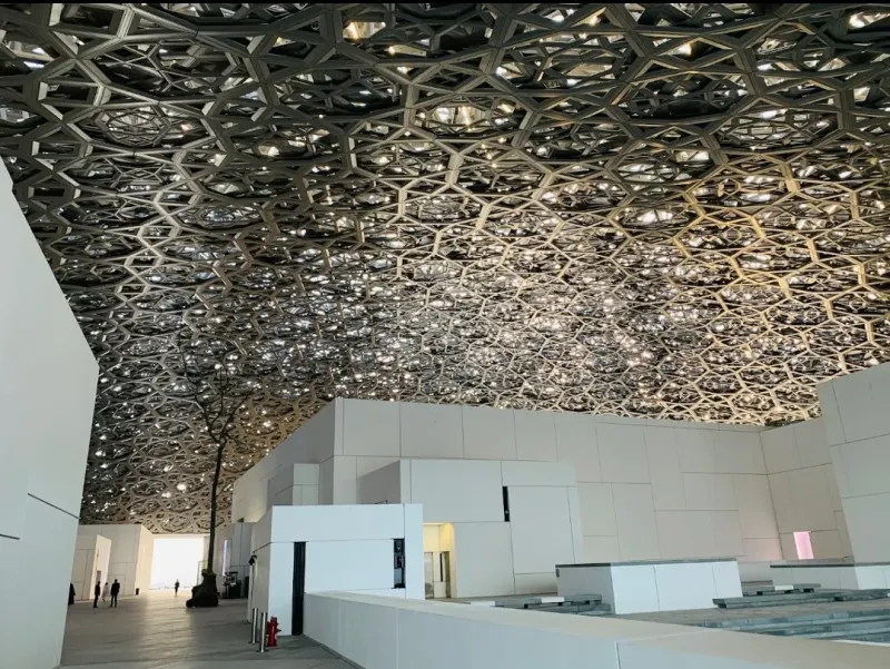 Under the patterned dome of the Louvre Abu Dhabi
