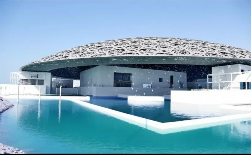 The dome of the Louvre Abu Dhabi above the water