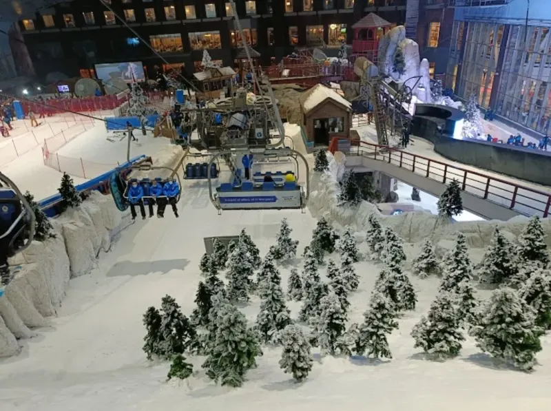 Chairlift and snowy trees inside Ski Dubai